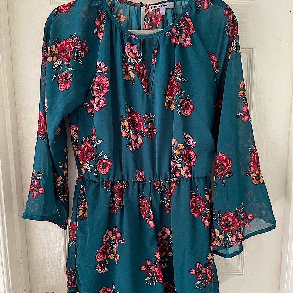Bailey Blue medium romper in dark green with burgundy and peach colored design